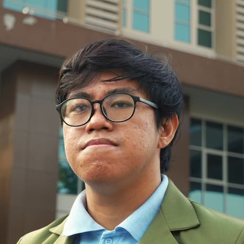A headshot of my face. I'm wearing my university's blazer.